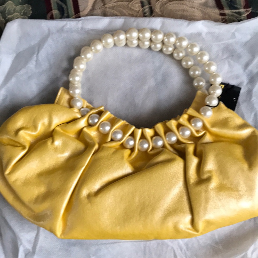 Yellow handbag with pearl handles